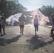 3rd Combat Aviation Brigade Soldiers and Families run in the Brawler 5k Color Run.