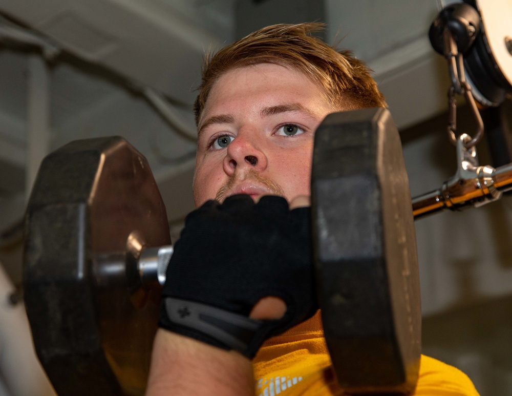 CTT3 Gage Merril Curls a Dumbbell during a Physical Training Session