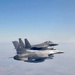 F-15E Strike Eagles fly alongside Romanian F-16s during Castle Forge