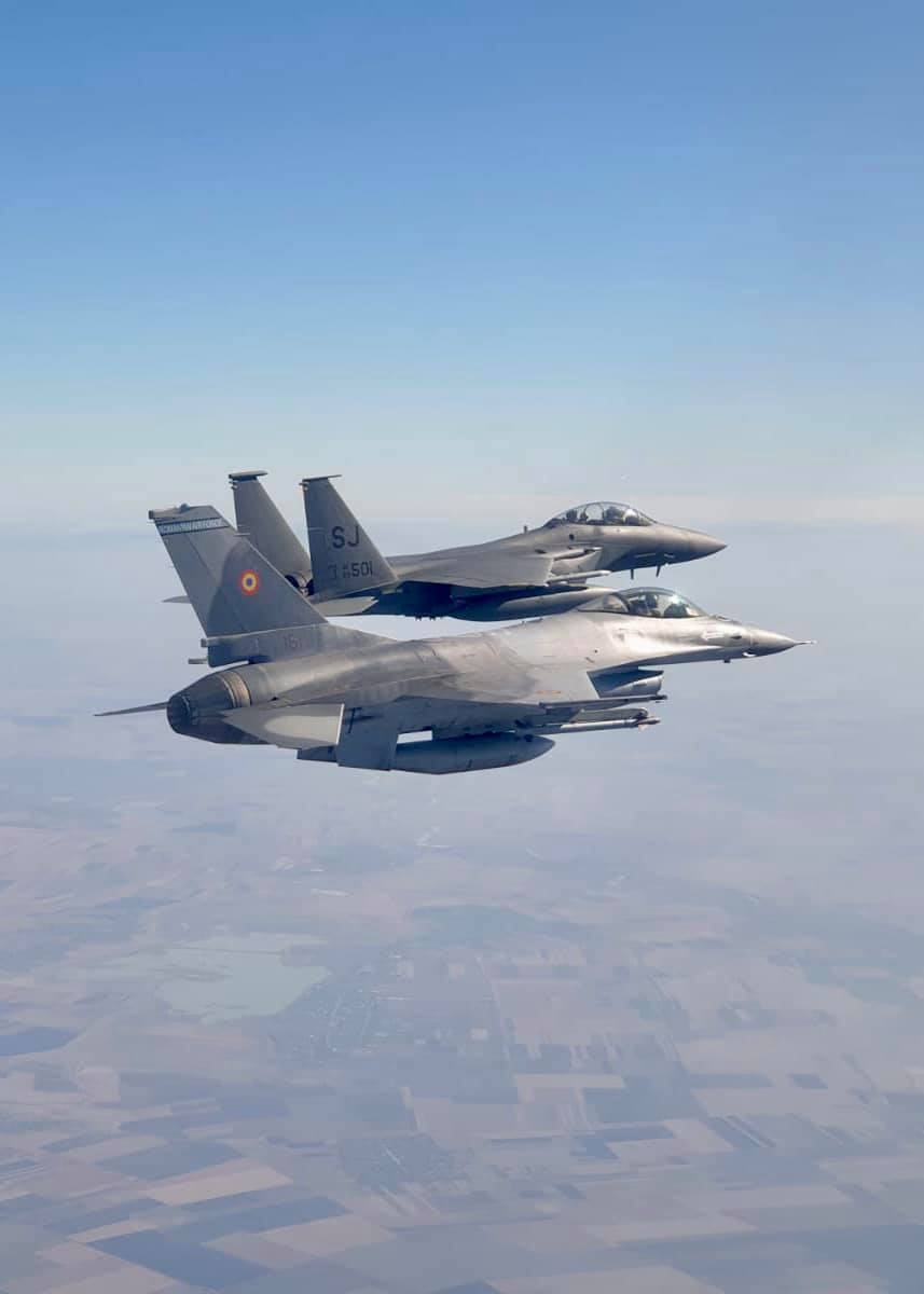 F-15E Strike Eagles fly alongside Romanian F-16s during Castle Forge