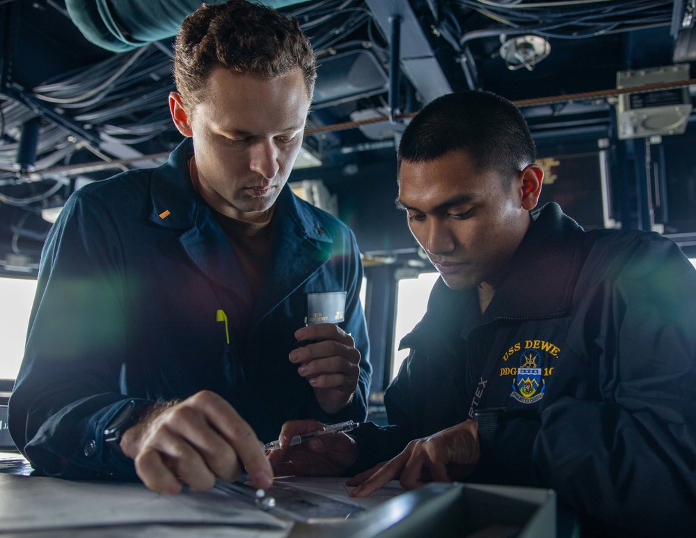 ENS Joseph Kelley and ENS Reuben Lumaban Create a Maneuvering Board aboard USS Dewey