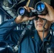 ENS Saesung Chang Scans for Surface Contacts aboard USS Dewey