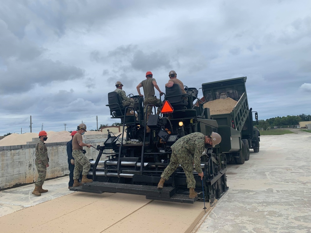 US Navy Seabees with NMCB-5 train on asphalt paver