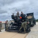 US Navy Seabees with NMCB-5 train on asphalt paver