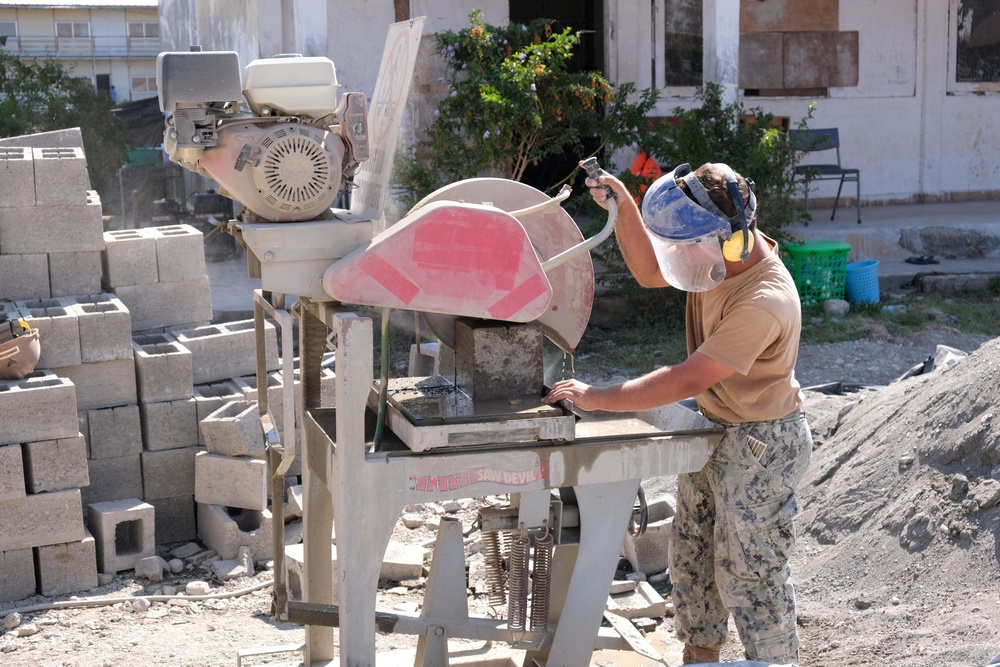 US Navy Seabees with NMCB-5 build a schoolhouse