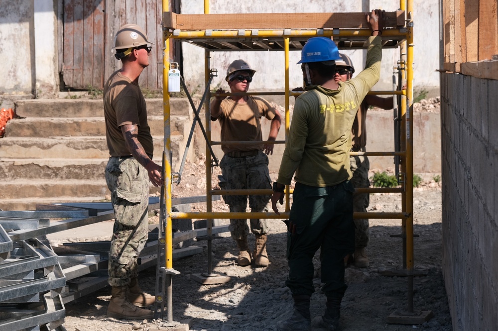 US Navy Seabees with NMCB-5 build a schoolhouse