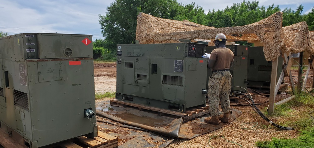 US Navy Seabees with NMCB-5 work with Marines from 7th ESB at Tinian, Northern Mariana Islands