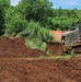US Navy Seabees with NMCB-5 work with Marines from 7th ESB at Tinian, Northern Mariana Islands