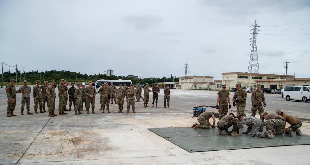 US Navy Seabees with NMCB-5 participate in joint airfield damage repair training