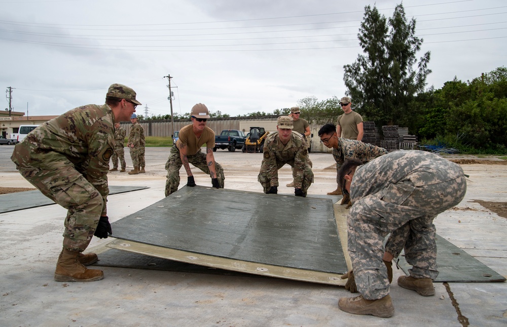 US Navy Seabees with NMCB-5 participate in joint airfield damage repair training