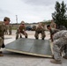 US Navy Seabees with NMCB-5 participate in joint airfield damage repair training