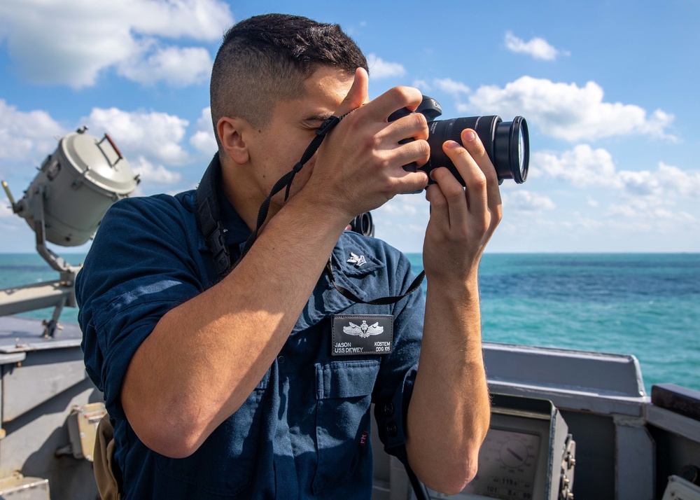 OS2 Jason Kostem Conducts Photography Collection aboard USS Dewey