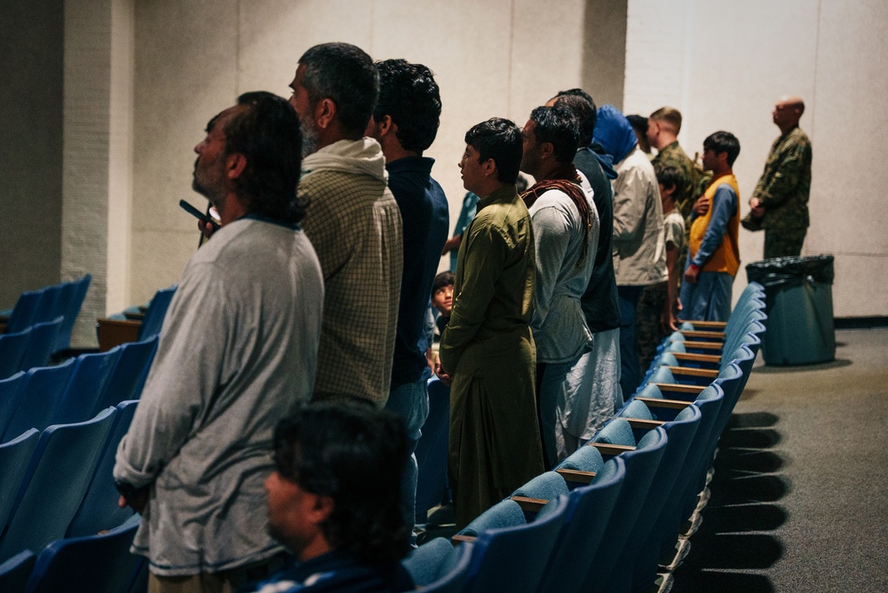 Afghan individuals watch the Cricket World Cup on Fort Pickett