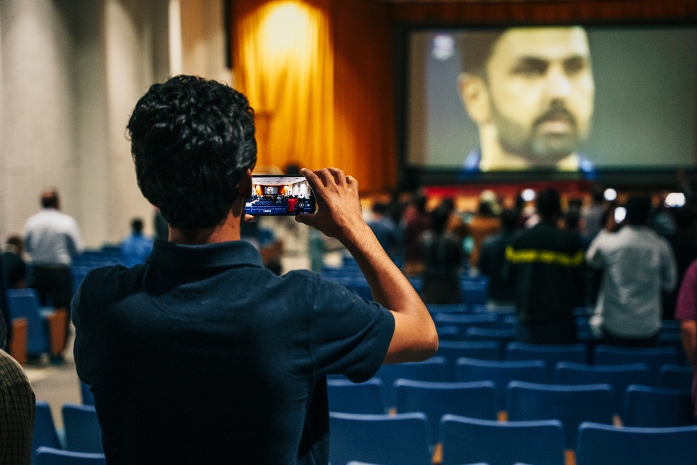 Afghan individuals watch the Cricket World Cup on Fort Pickett