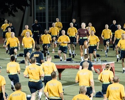 211021-N-TE695-0002 NEWPORT, R.I. (Oct. 21, 2021) Officer Candidate Casey Ouellette leads the division physical training at OCS