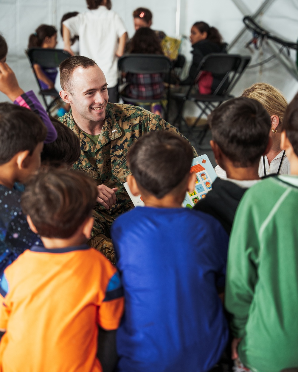 Task Force Pickett personnel read books to Afghan children