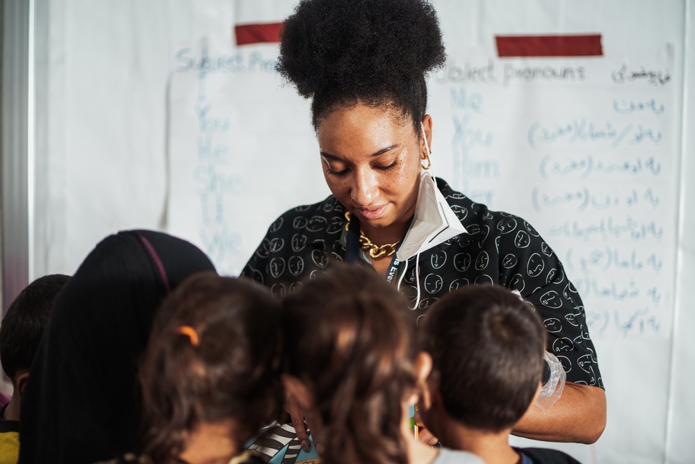 Task Force Pickett personnel read books to Afghan children