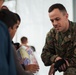 Task Force Pickett personnel read books to Afghan children