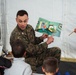 Task Force Pickett personnel read books to Afghan children