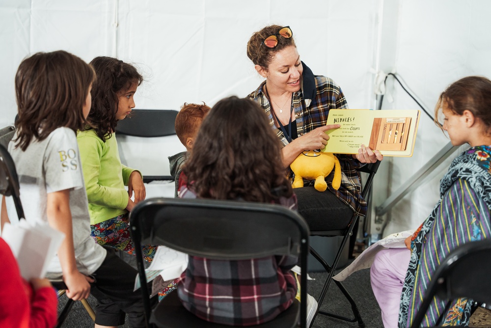 Task Force Pickett personnel read books to Afghan children