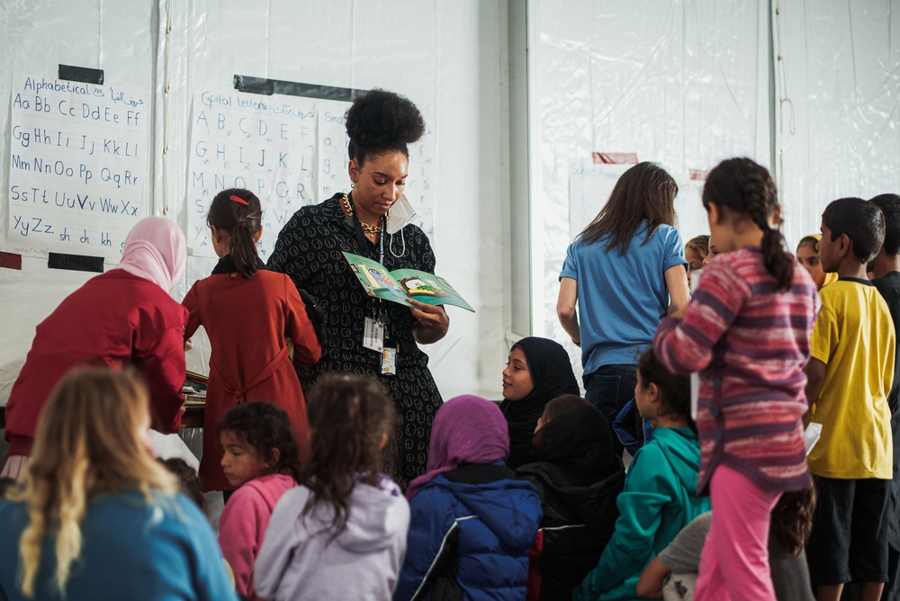Task Force Pickett personnel read books to Afghan children