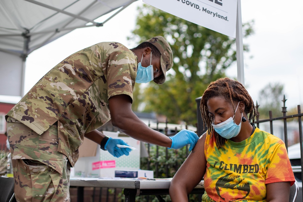 MDNG members of Maryland’s Vaccine Equity Task Force give COVID-19 vaccines in Baltimore