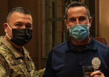 Task Force 46 commanding general, Maj. Gen. Estrada coins LAPD officer Ryan White during DUT LA exercise