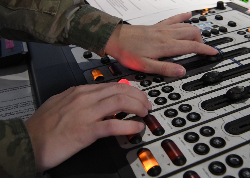AFN Kaiserslautern radio DJ adjusts levels on board
