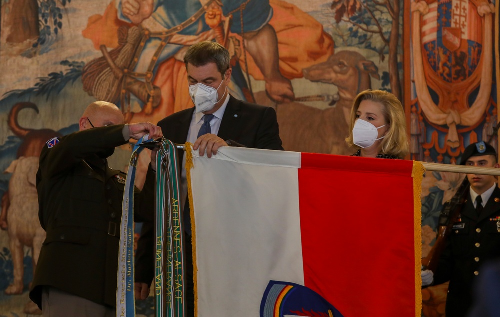 Gen. Christopher Cavoli Ties a Streamer on the U.S. Army EURAF Flag