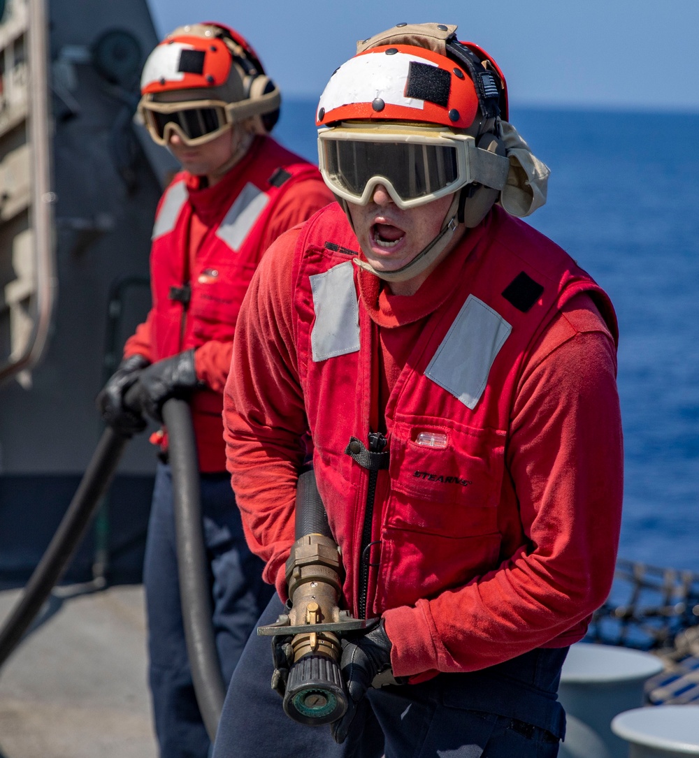 USS Billings Sailor Responds to a Simulated Fire During Crash and Salvage Drill