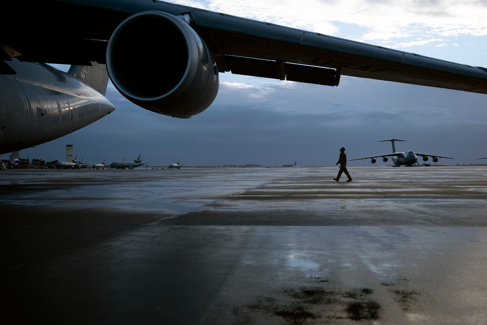 C-5M aircrew departing Travis AFB flight line