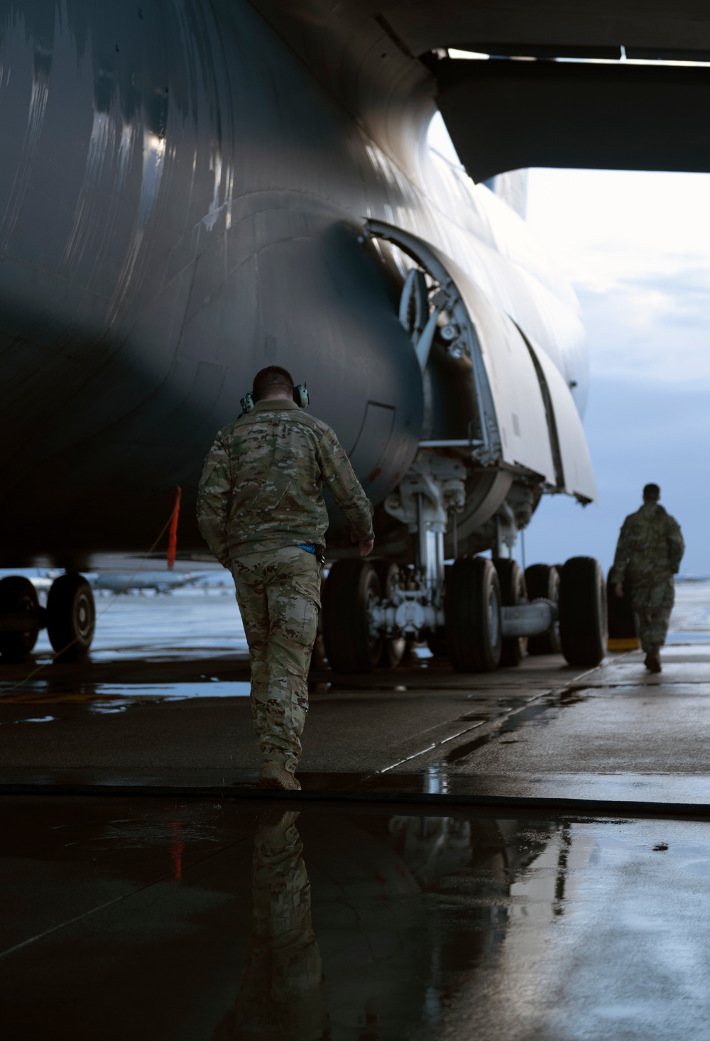 C-5M aircrew departing Travis AFB flight line