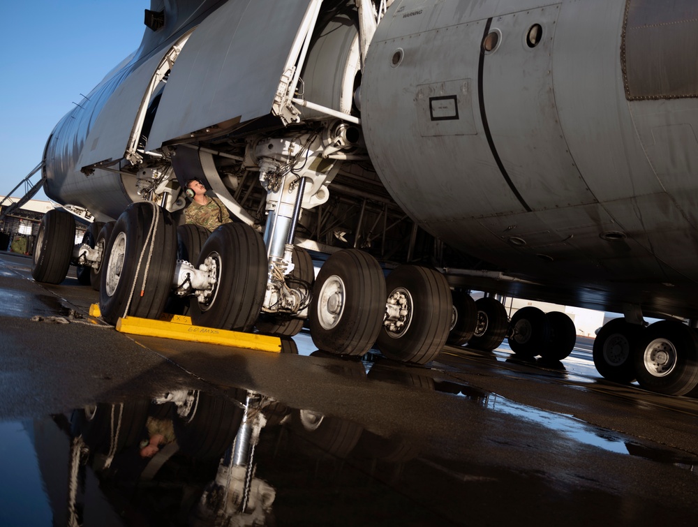 C-5M aircrew departing Travis AFB flight line