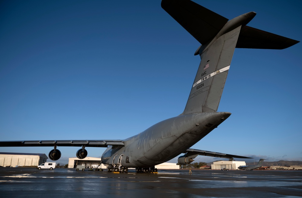 C-5M aircrew departing Travis AFB flight line