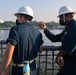 USS Sioux City Sailors Assess the Ship’s Distance From the Pier During Sea and Anchor Detail