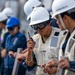 BM2 Jorge Kanyelis Speaks into a Handheld Radio aboard USS Dewey during a Replenishment-at-sea