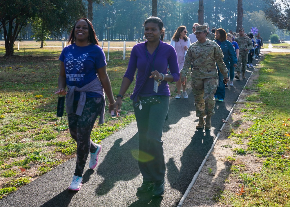 SJAFB Airmen participate in Walk in my Shoes, Domestic Violence Awareness