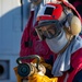 DCFN Vinz Torres Holds an AFFF Hose on the Flight Deck aboard USS Dewey during Crash and Salvage Training