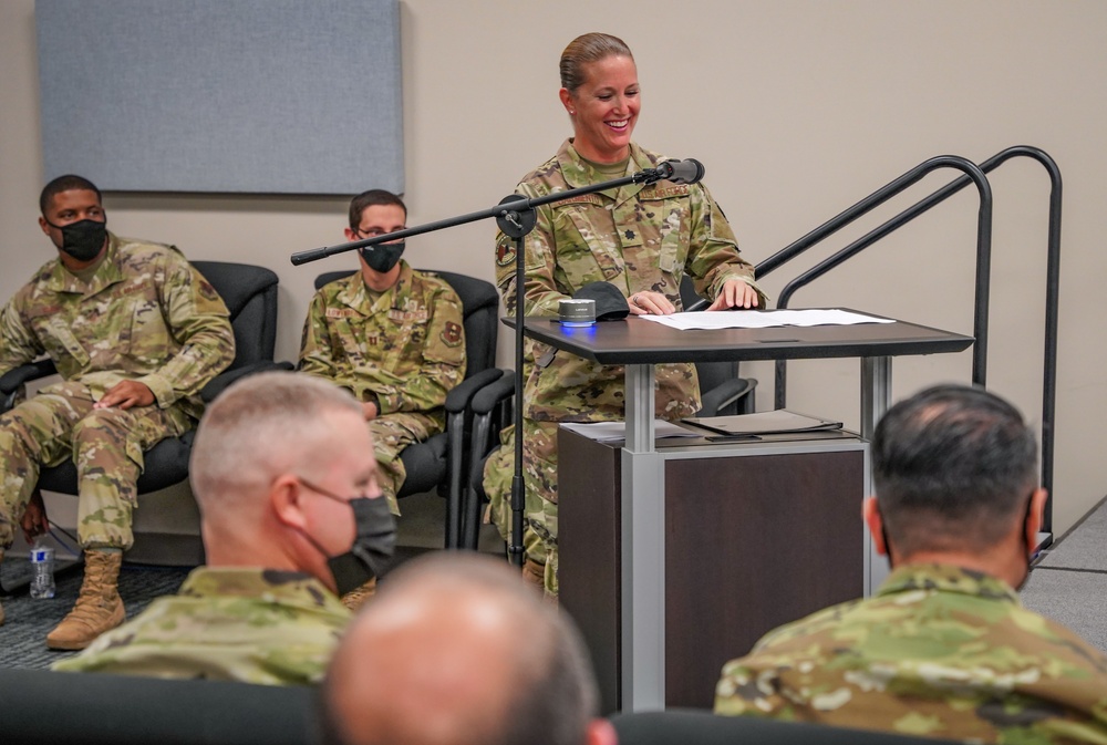 Lt. Col. Traci Sarmiento provides remarks for the SIPRNet mission transfer ceremony