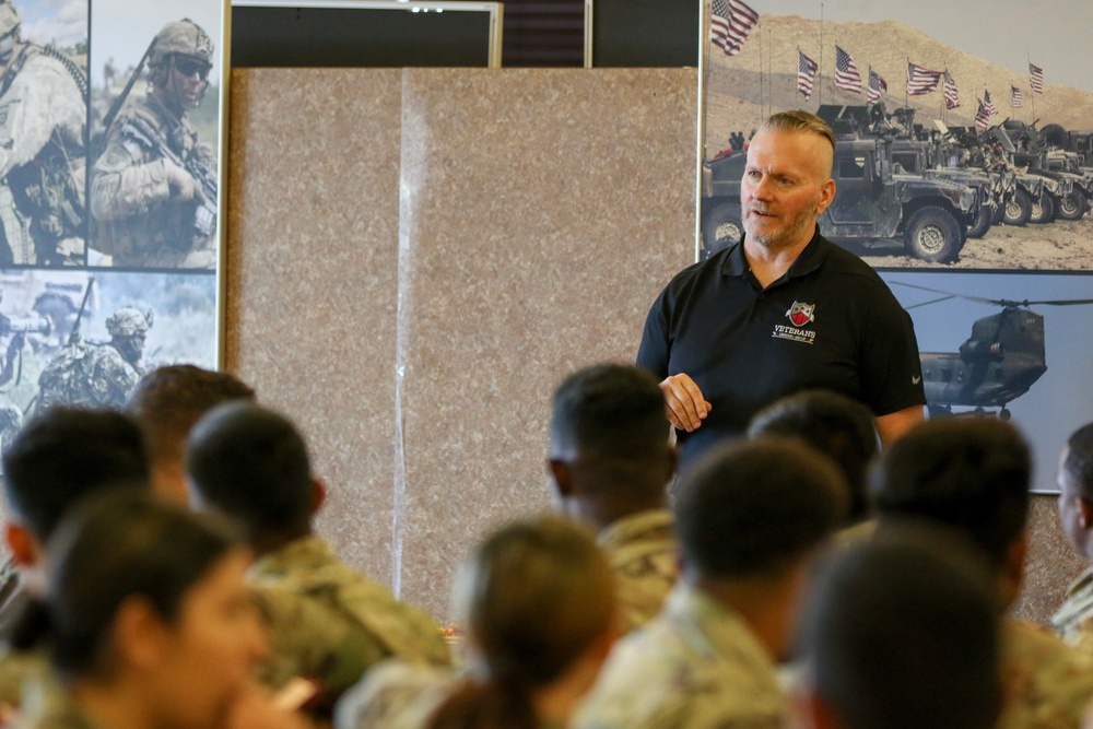 Retired SEAC CSM John Wayne Troxell speaks with Paratroopers from 1st Brigade Combat Team, 82nd Airborne Division.