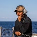 BMSN Kentrell Howard Speaks into the Aft Lookout Headset aboard USS Dewey
