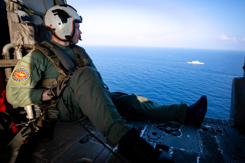 HSC 22 Sailor Keeps Eyes on the Target of Interest During a Bilateral Maritime Interdiction Exercise