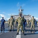 U.S. Navy Sailors and U.S. Coast Guardsman Observe Morning Colors