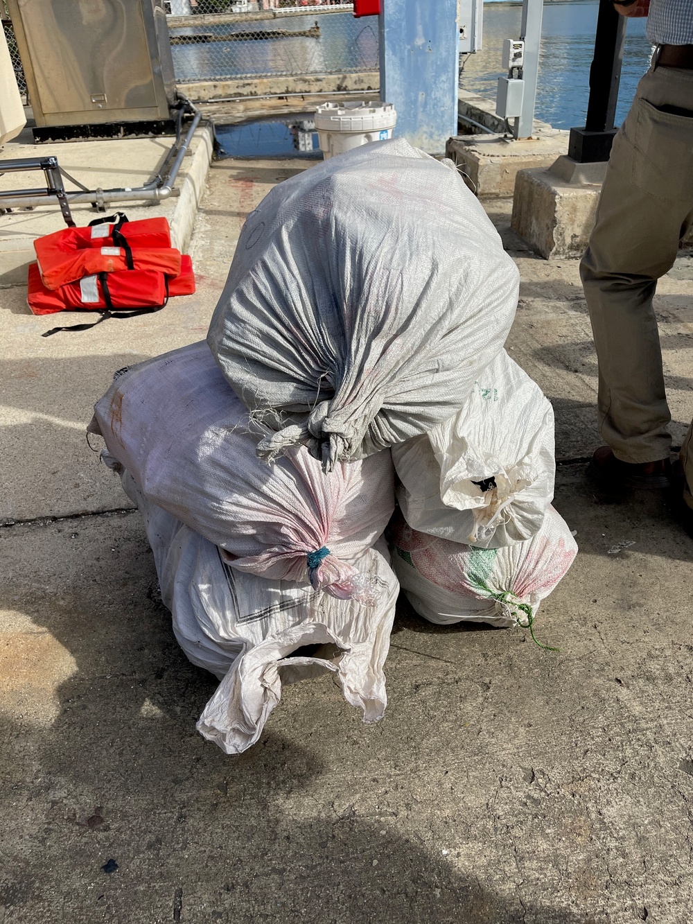 Coast Guard transfers custody of 3 smugglers, $3.75 million in seized cocaine to federal agents in San Juan, Puerto Rico