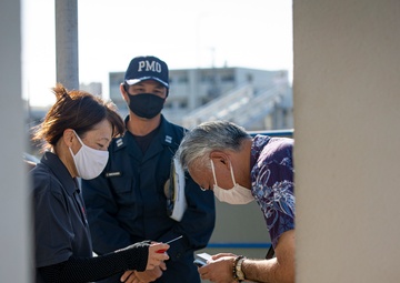 US Marines and local community residents participate in a Tsunami Evacuation Drill