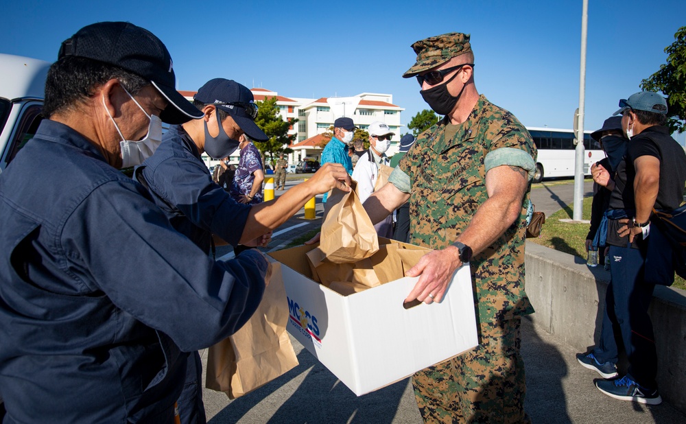 US Marines and local community residents participate in a Tsunami Evacuation Drill