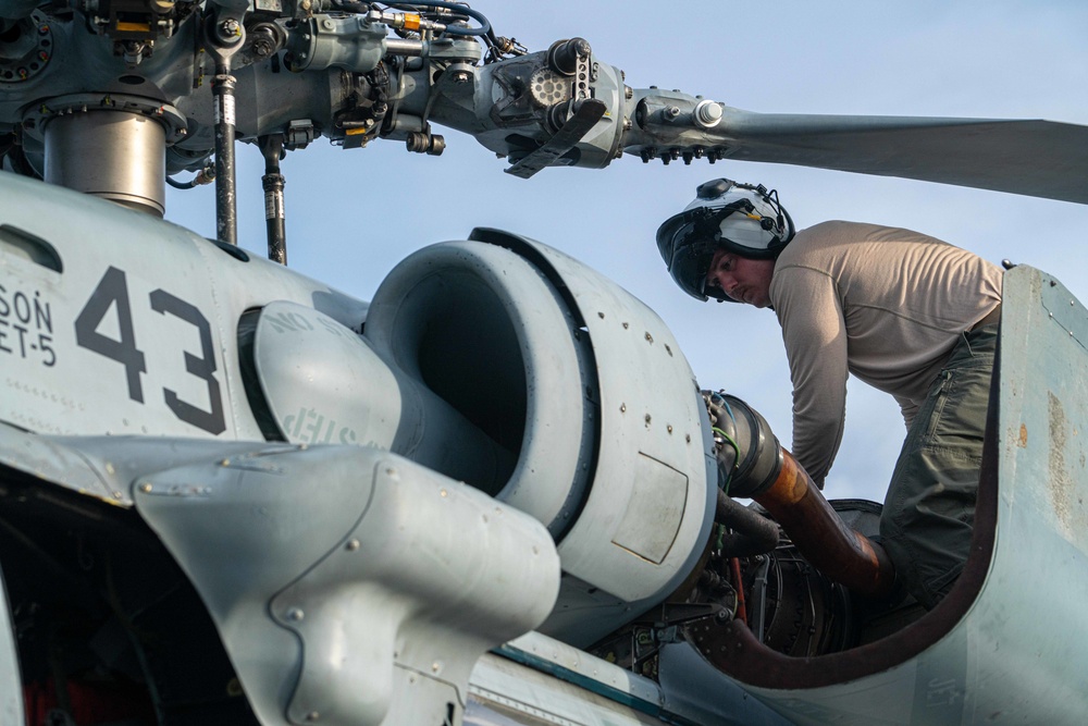 Helicopter Sea Combat 23 (HSC 23) Aviator Conducts Pre-Flight Checks