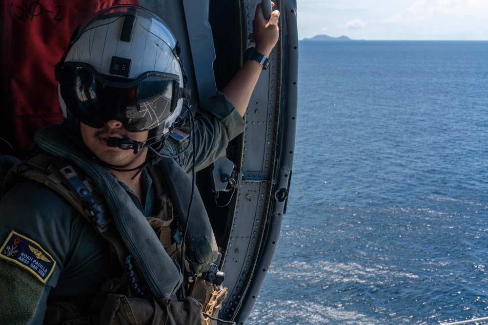 Helicopter Sea Combat 23 (HSC 23) Sailor transits the South China Sea