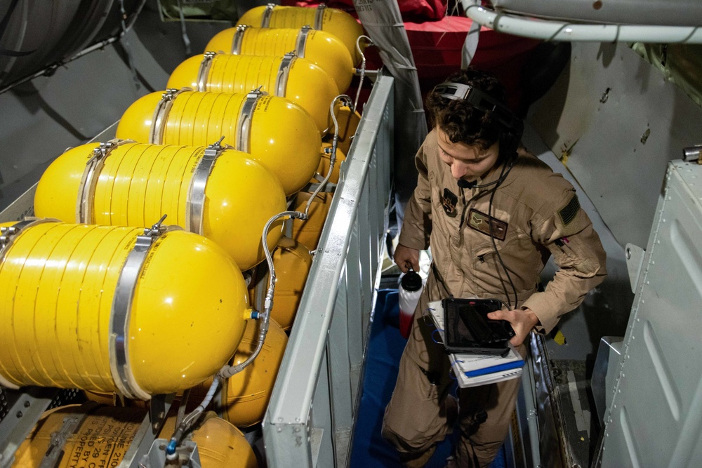 The 93rd Expeditionary Air Refueling Squadron performs an over-the-shoulder flight with the 384th EARS