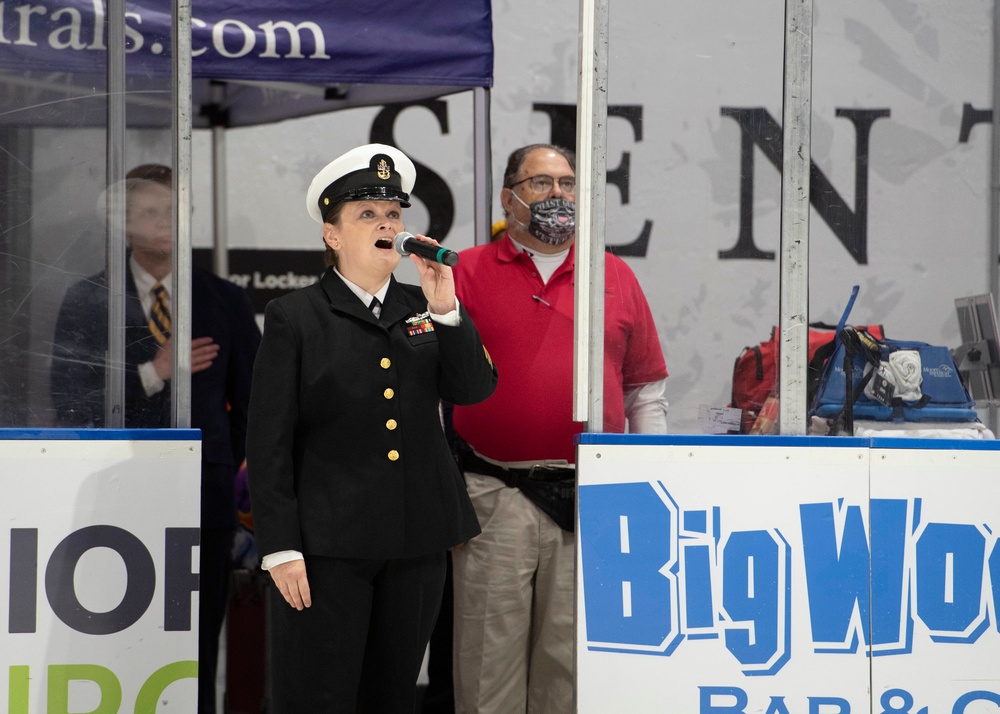 Chief sings national anthem